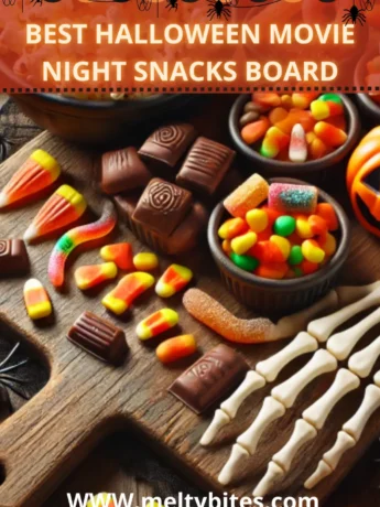 Halloween Movie Night Snack Board with assorted Halloween candies and popcorn.